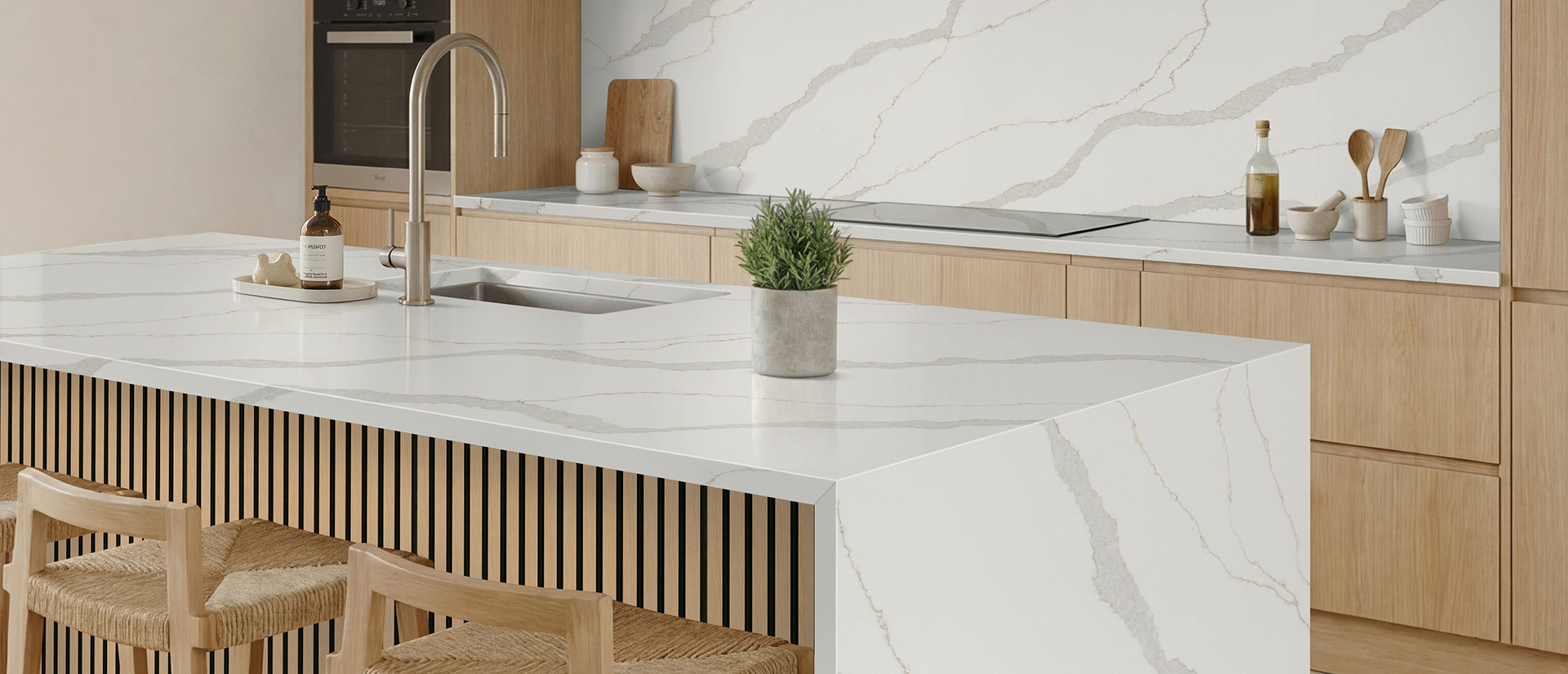 Kitchen with Calacatta Idillio quartz countertops and island