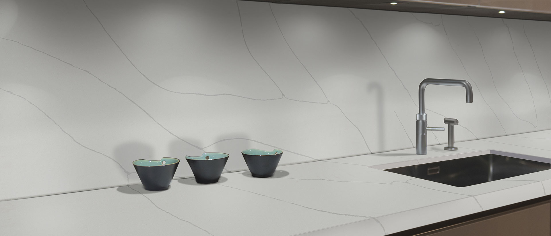Kitchen with Calacatta Ultra quartz countertops and island